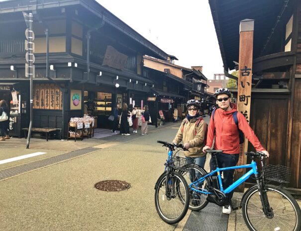 Bike travelers at the famous street in Takayama