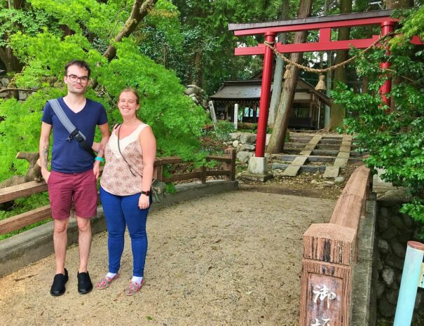 Irish guests standing in front of the local shrine in Takayama area