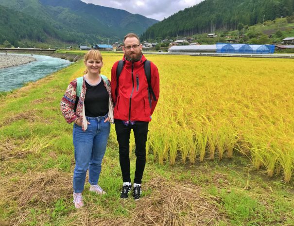 British tourists standing in front of rice field