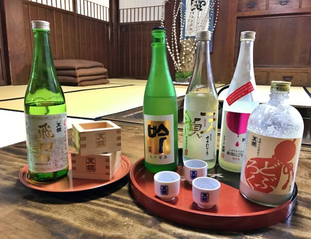 Sake bottles arranged for tasting in the traditional Japanese room