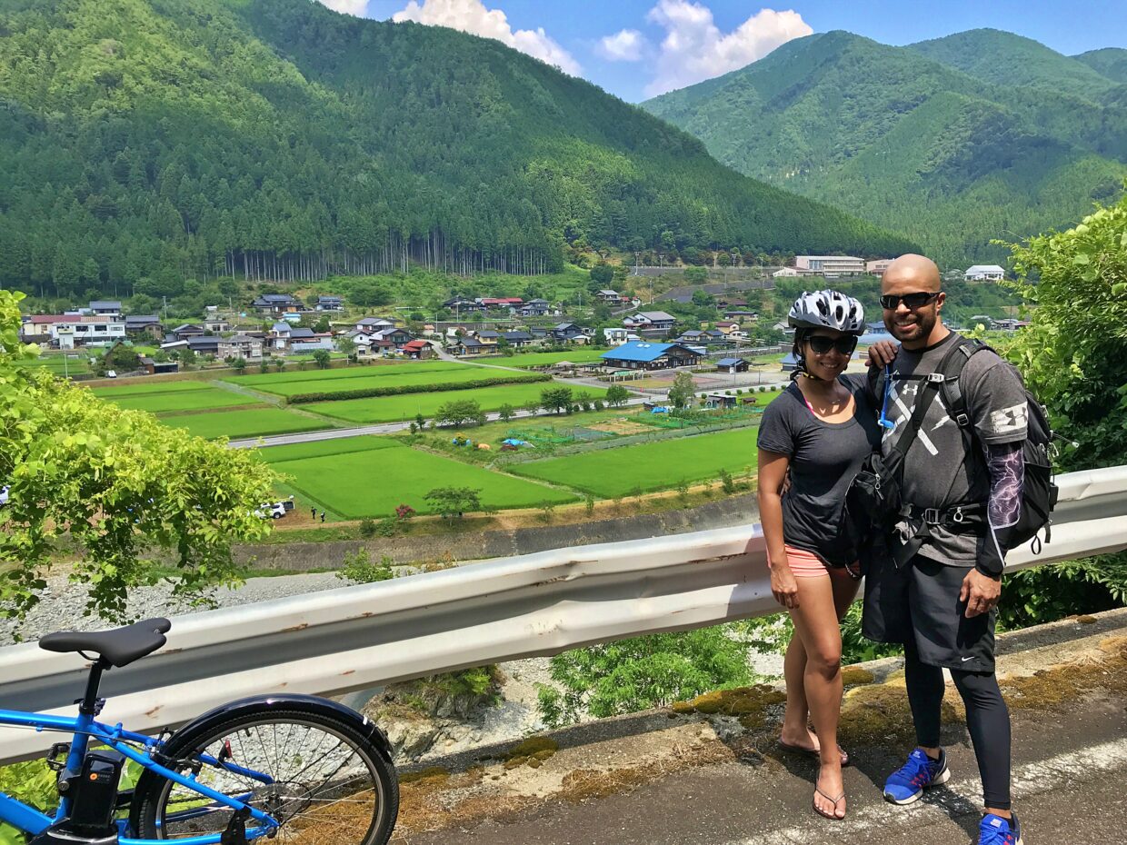 A US couple enjoying the scenery of countryside in Japan