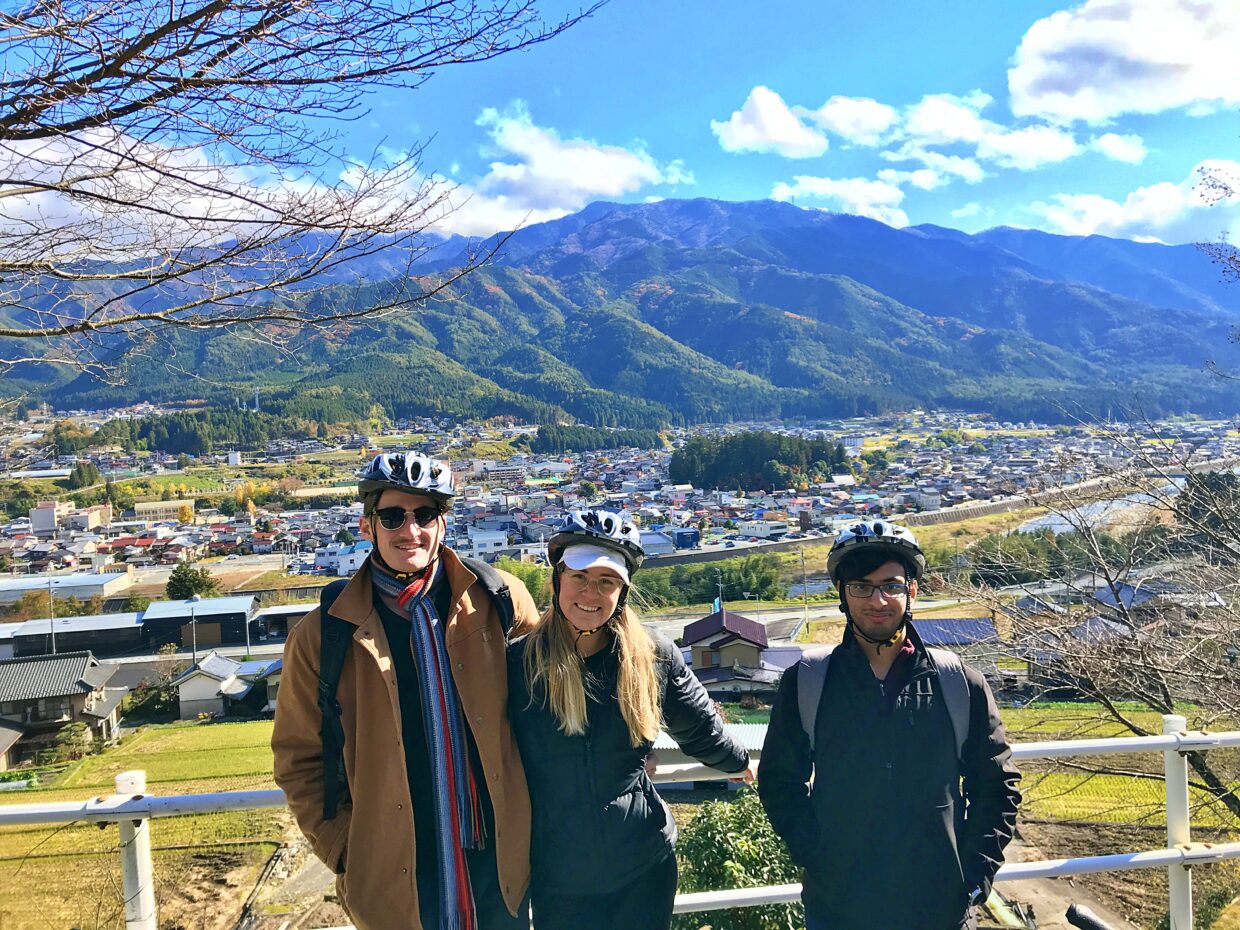 Foreign tourists in front of the view of Hida-Hagiwara